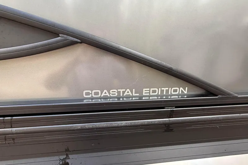Slide: The Image of 2023 Barletta Corsa 23U Coastal Edition boat detail with sleek design elements. - 11