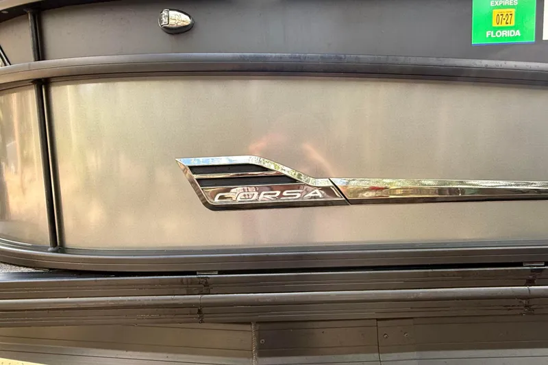 Slide: The Image of 2023 Barletta Corsa 23U boat emblem with Florida registration sticker. - 12