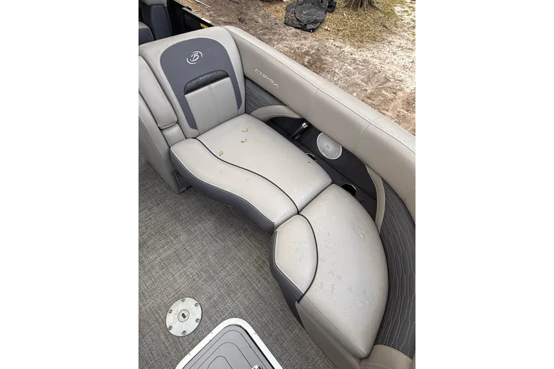 Slide: The Image of 2023 Barletta Corsa 23U boat interior with gray seating and speaker detail. - 8