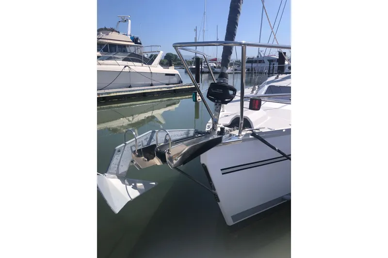 Slide: The Image of Catalina 355 sailboat (2020) docked, featuring anchor and bow details. - 10
