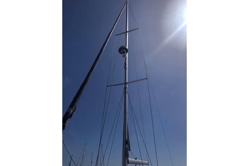 Slide: The Image of Tall mast of a 2020 Catalina 355 sailboat against a clear blue sky. - 14