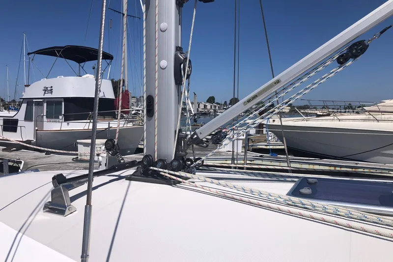 Slide: The Image of Catalina 355 sailboat deck with rigging, docked at marina, clear blue sky. - 15