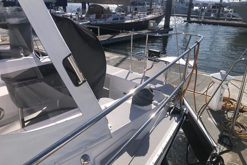 Slide: The Image of Catalina 355 sailboat docked at marina, showcasing sleek design and modern features. - 17