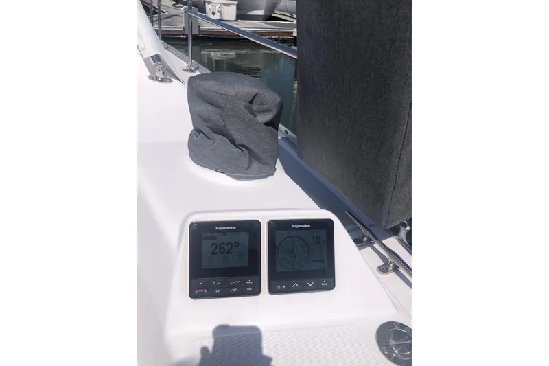 Slide: The Image of Cockpit instruments on a 2020 Catalina 355 sailboat, displaying navigation data. - 19
