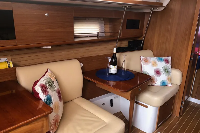 Slide: The Image of Interior of 2020 Catalina 355 yacht with cozy seating and decorative pillows. - 2