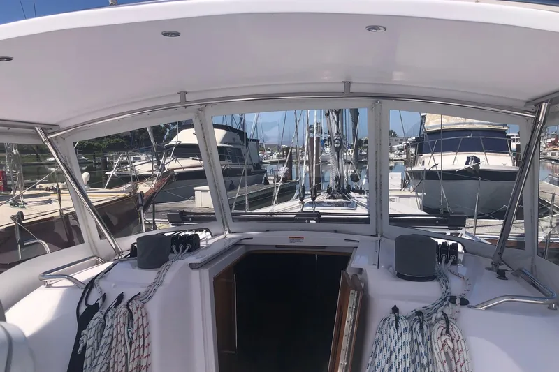 Slide: The Image of Cockpit view of a 2020 Catalina 355 sailboat docked at a marina. - 21