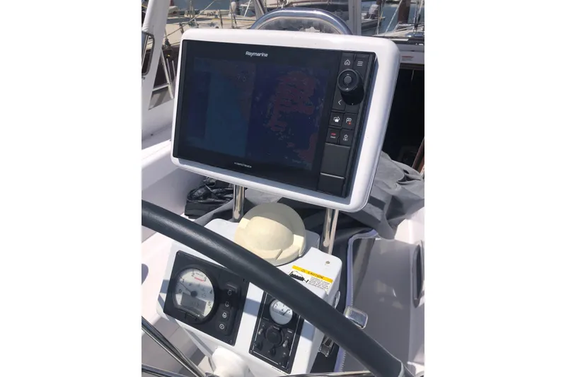 Slide: The Image of Cockpit of 2020 Catalina 355 sailboat with Raymarine navigation system and steering wheel. - 23