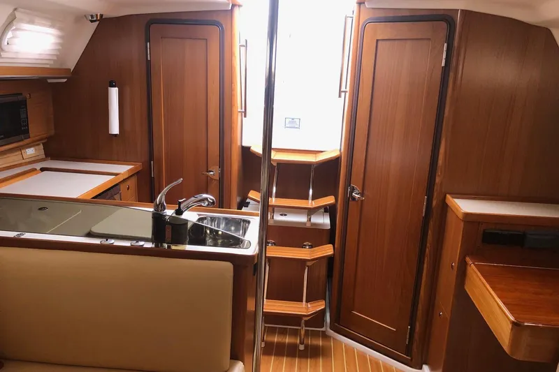 Slide: The Image of Interior of 2020 Catalina 355 yacht with wood finish and modern kitchen amenities. - 8