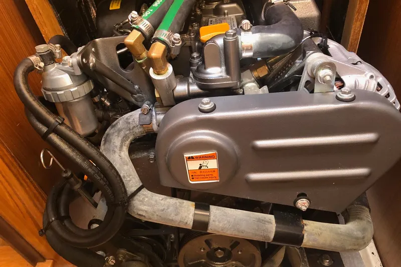 Slide: The Image of Engine compartment of a 2020 Catalina 355 sailboat, showcasing detailed mechanical components. - 9