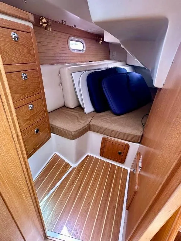 Slide: The Image of 2007 Catalina 36 MkII cabin interior with wood finish and storage compartments. - 12