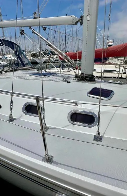 Slide: The Image of 2007 Catalina 36 MkII sailboat deck with rigging in a marina setting. - 18