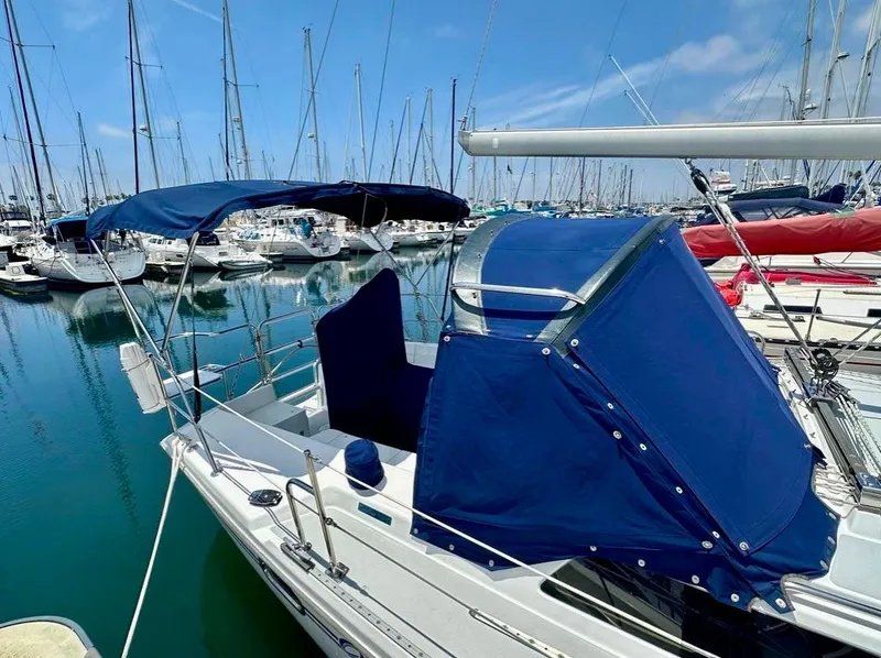 Slide: The Image of 2007 Catalina 36 MkII sailboat with blue canopy docked in marina. - 20