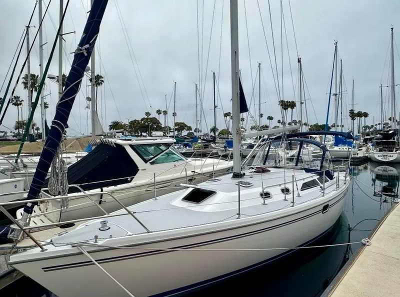 Slide: The Image of 2007 Catalina 36 MkII sailboat docked in a marina with other boats. - 22