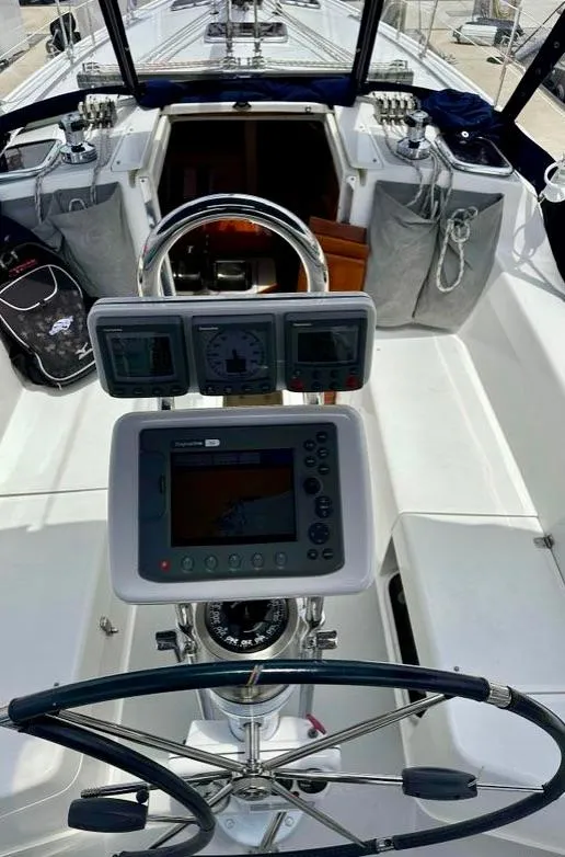 Slide: The Image of Cockpit of a 2007 Catalina 36 MkII sailboat with navigation instruments and steering wheel. - 7