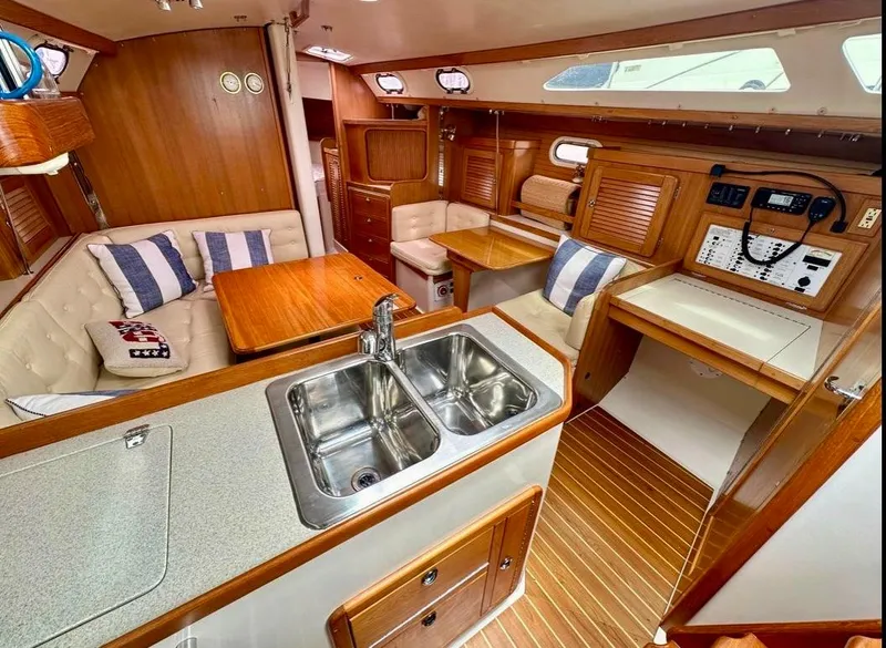 Slide: The Image of Interior of 2007 Catalina 36 MkII sailboat with wood finish and cozy seating area. - 8