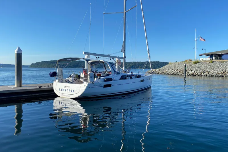 The Image of 2018 Beneteau Oceanis 41.1 sailboat docked in a serene marina setting. - 0