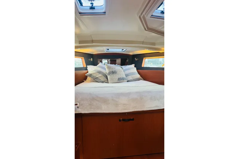 Slide: The Image of Cozy cabin interior of 2018 Beneteau Oceanis 41.1 yacht with plush bedding. - 10