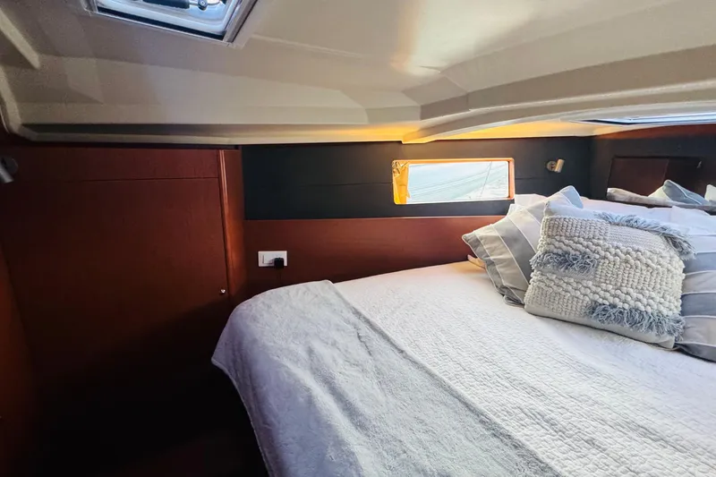 Slide: The Image of Cozy cabin interior of 2018 Beneteau Oceanis 41.1 with plush bedding and natural light. - 11