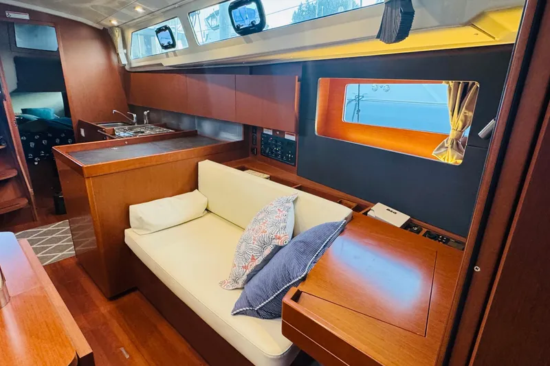 Slide: The Image of Interior of 2018 Beneteau Oceanis 41.1 yacht with cozy seating and modern kitchen. - 8