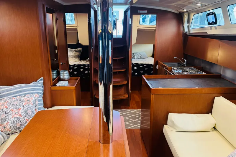 Slide: The Image of Interior of 2018 Beneteau Oceanis 41.1 yacht, featuring cozy wood finish and modern amenities. - 9