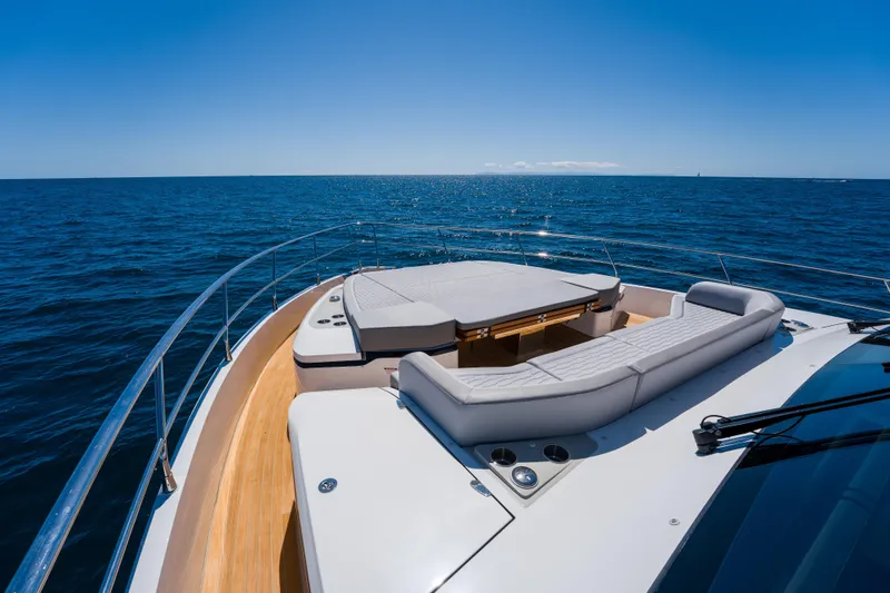 Slide: The Image of Luxurious 2024 Pearl 72 yacht deck with ocean view under clear blue sky. - 107