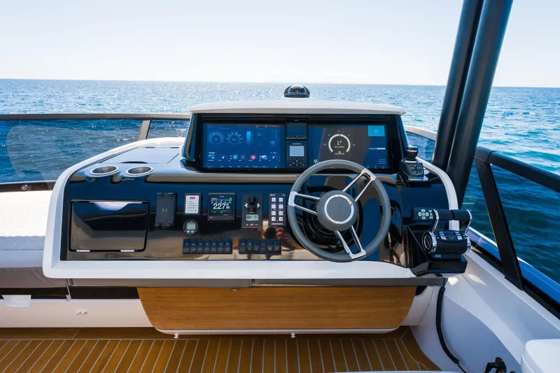Slide: The Image of 2024 Pearl 72 yacht helm with advanced navigation systems and ocean view. - 118
