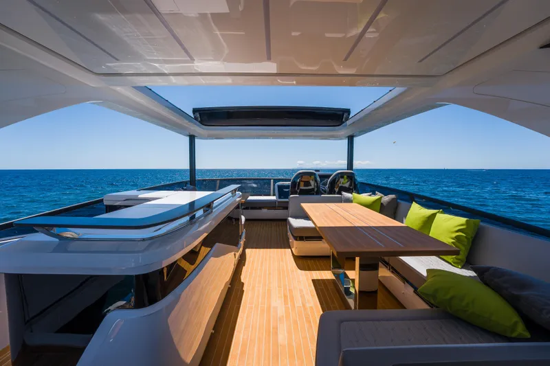Slide: The Image of Luxurious 2024 Pearl 72 yacht interior with ocean view, featuring modern seating and dining area. - 121