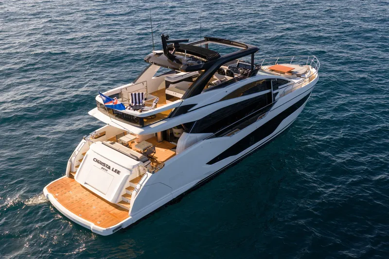 Slide: The Image of Luxurious 2024 Pearl 72 yacht cruising on open sea, showcasing sleek design and spacious deck. - 19