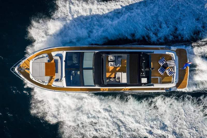 Slide: The Image of Aerial view of 2024 Pearl 72 yacht cruising on open water. - 2