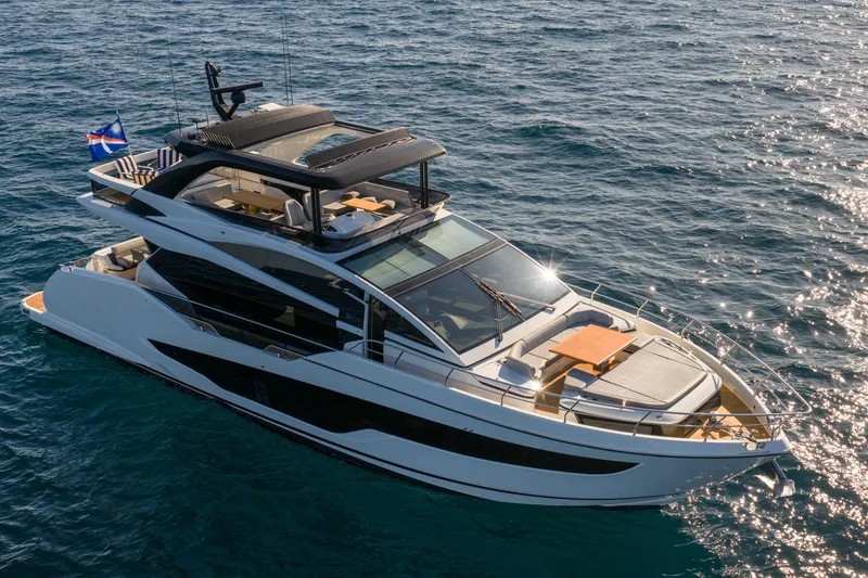 Slide: The Image of Luxurious 2024 Pearl 72 yacht cruising on open water, featuring sleek design and spacious deck. - 21