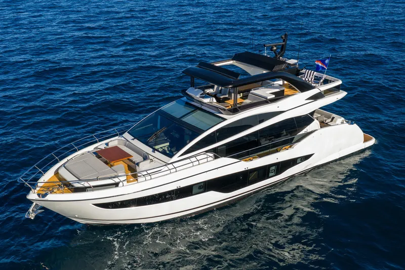 Slide: The Image of Luxurious 2024 Pearl 72 yacht cruising on open blue sea. - 23