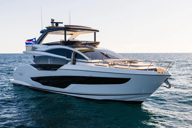 Slide: The Image of Luxurious 2024 Pearl 72 yacht cruising on open sea under clear sky. - 29