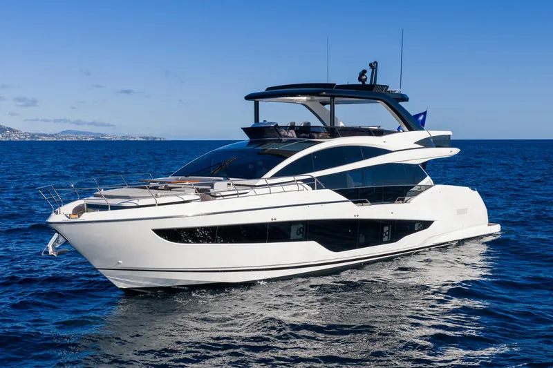 Slide: The Image of Luxurious 2024 Pearl 72 yacht cruising on open sea under clear blue sky. - 31