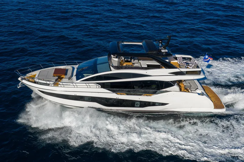 Slide: The Image of 2024 Pearl 72 yacht cruising on open sea, showcasing sleek design and luxury features. - 4