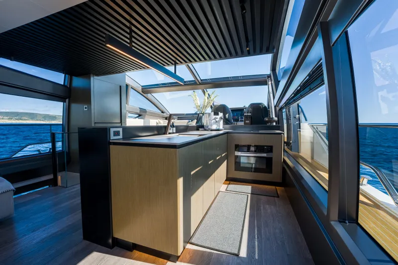 Slide: The Image of Luxurious interior of 2024 Pearl 72 yacht with modern kitchen and panoramic ocean views. - 42