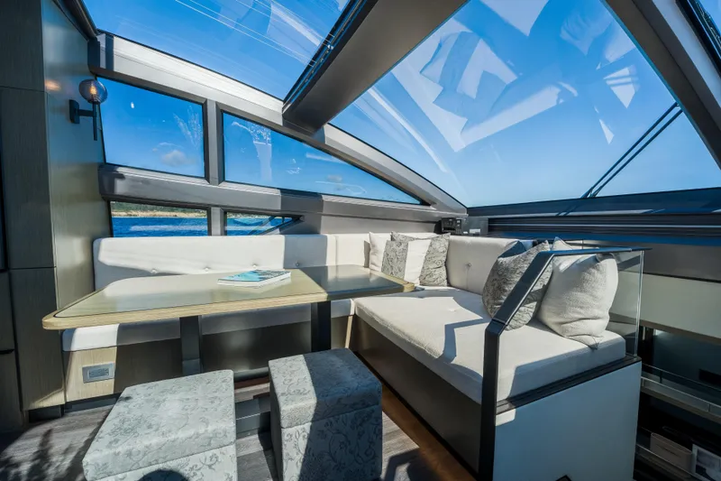 Slide: The Image of Luxurious interior of 2024 Pearl 72 yacht with panoramic windows and elegant seating area. - 43