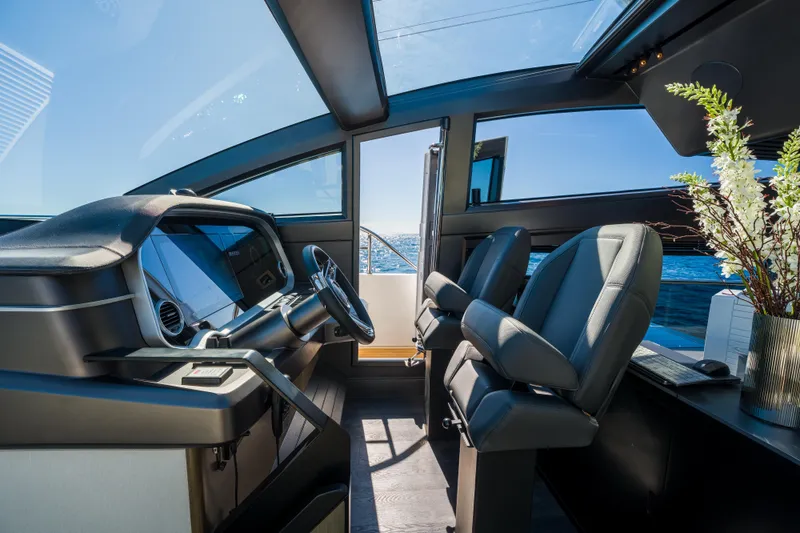 Slide: The Image of Luxurious 2024 Pearl 72 yacht cockpit with modern steering and panoramic ocean view. - 44
