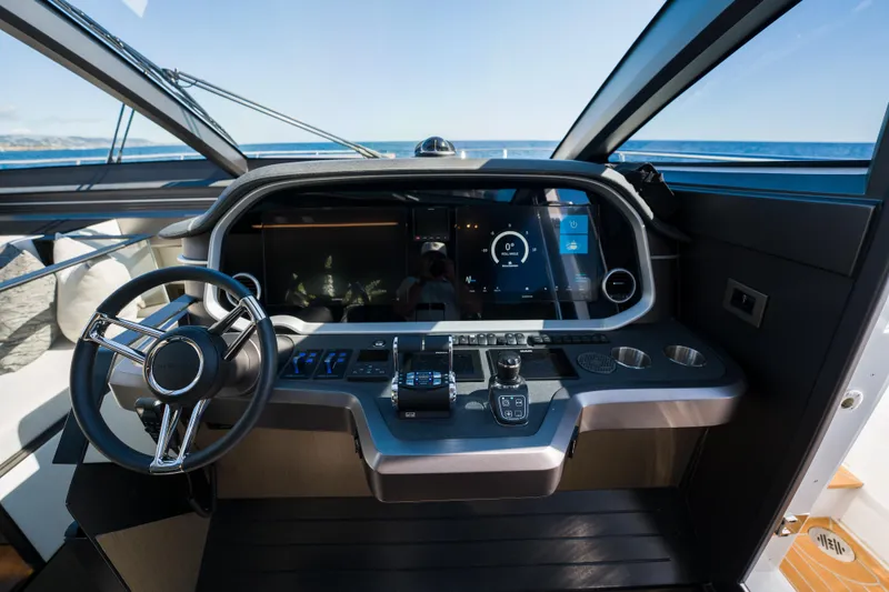 Slide: The Image of Modern helm of 2024 Pearl 72 yacht with advanced navigation controls and sleek design. - 46