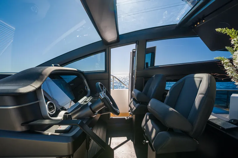 Slide: The Image of Luxurious interior of 2024 Pearl 72 yacht with modern helm and ocean view. - 47