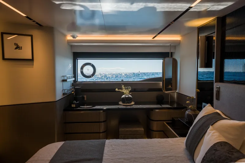 Slide: The Image of Luxurious interior of 2024 Pearl 72 yacht with ocean view through large window. - 52