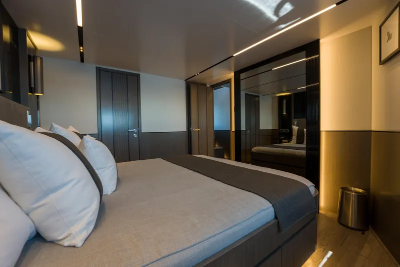 Slide: The Image of Luxurious bedroom interior on 2024 Pearl 72 yacht, featuring modern design and elegant lighting. - 54