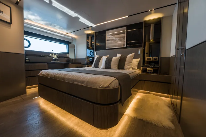 Slide: The Image of Luxurious bedroom interior of 2024 Pearl 72 yacht with modern design and ambient lighting. - 55