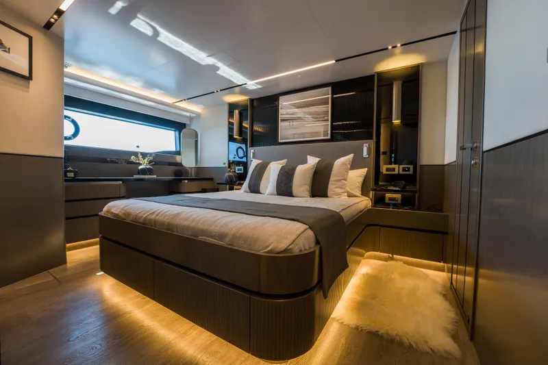 Slide: The Image of Luxurious bedroom interior on 2024 Pearl 72 yacht, featuring modern design and ambient lighting. - 56