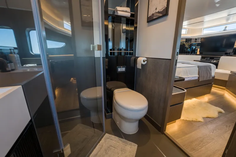 Slide: The Image of Luxurious bathroom and bedroom interior on a 2024 Pearl 72 yacht, featuring modern design elements. - 59