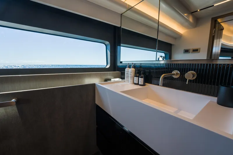 Slide: The Image of Luxurious bathroom interior on 2024 Pearl 72 yacht with ocean view through window. - 60