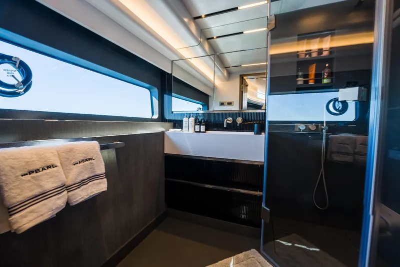 Slide: The Image of Luxurious bathroom interior on 2024 Pearl 72 yacht, featuring modern fixtures and elegant design. - 61