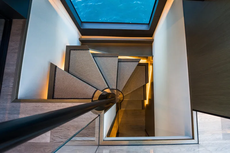 Slide: The Image of Spiral staircase with modern design on 2024 Pearl 72 yacht. - 65