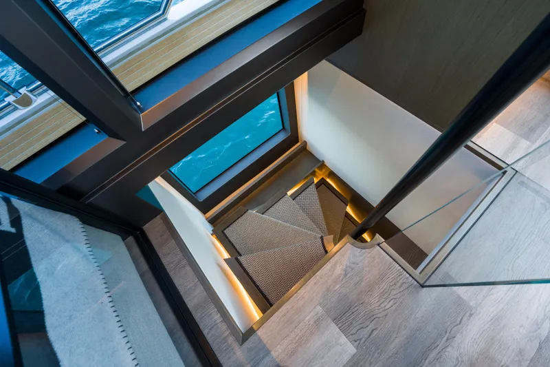 Slide: The Image of Luxurious interior staircase on 2024 Pearl 72 yacht with ocean view. - 66