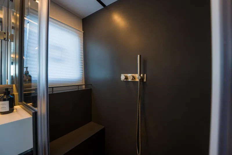 Slide: The Image of Modern bathroom with sleek shower design in Pearl 72, 2024 model. - 68