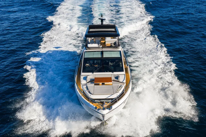 Slide: The Image of Luxurious 2024 Pearl 72 yacht cruising on open sea, creating a dynamic wake. - 7